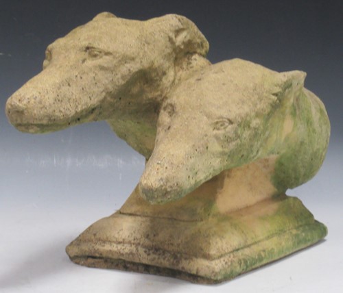 Lot 860 - A composite garden statue of two sight...