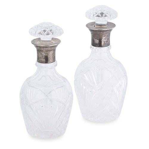 Lot 548 - A pair of George VI silver topped cut glass decanters