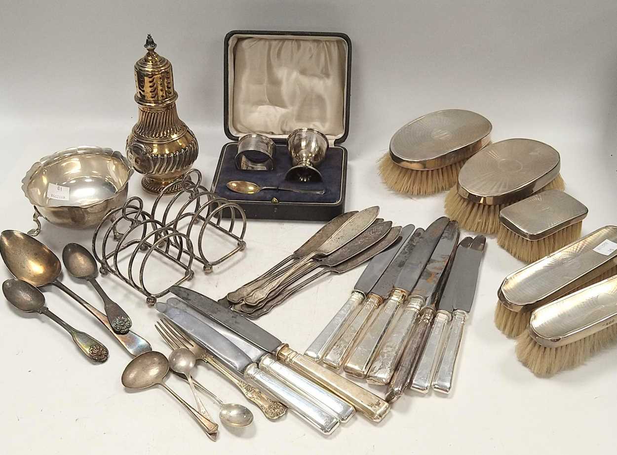 Lot 365 - A collection of silverware including toast...