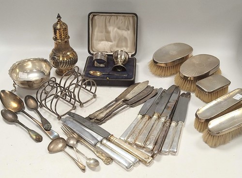 Lot 365 - A collection of silverware including toast...
