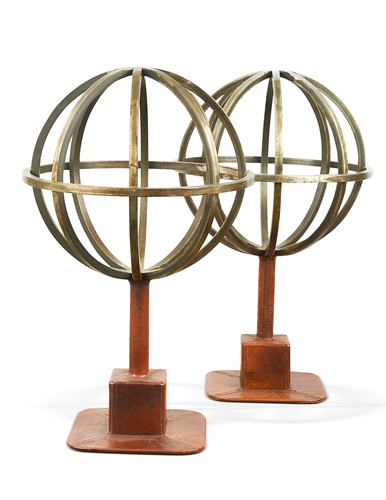 Lot 277 - A pair of patinated steel and leather orbs, modern