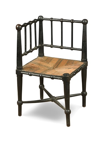 Lot 170 - An Aesthetic period ebonised corner chair