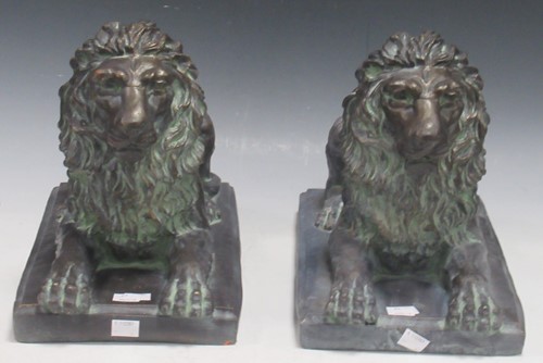 Lot 56 - A pair of bronzed terracotta models of lions,...
