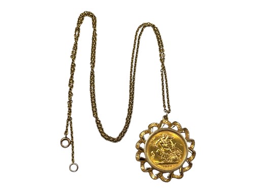 Lot 394 - A full sovereign dated 1968, held within a...