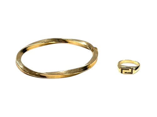 Lot 389 - A bangle stamped '9Kt' weight 13.5g, together...