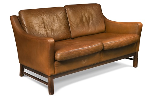 Lot 262 - A Danish mid-century brown leather two-seat sofa