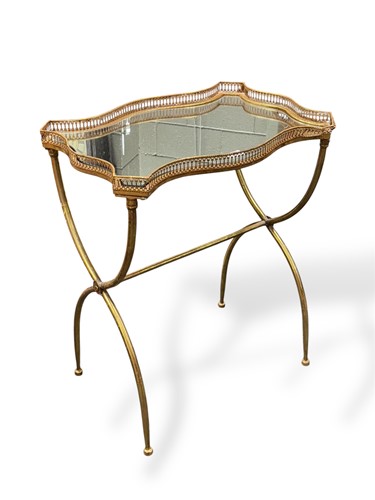 Lot 807 - A gilt painted and mirrored side table, with...