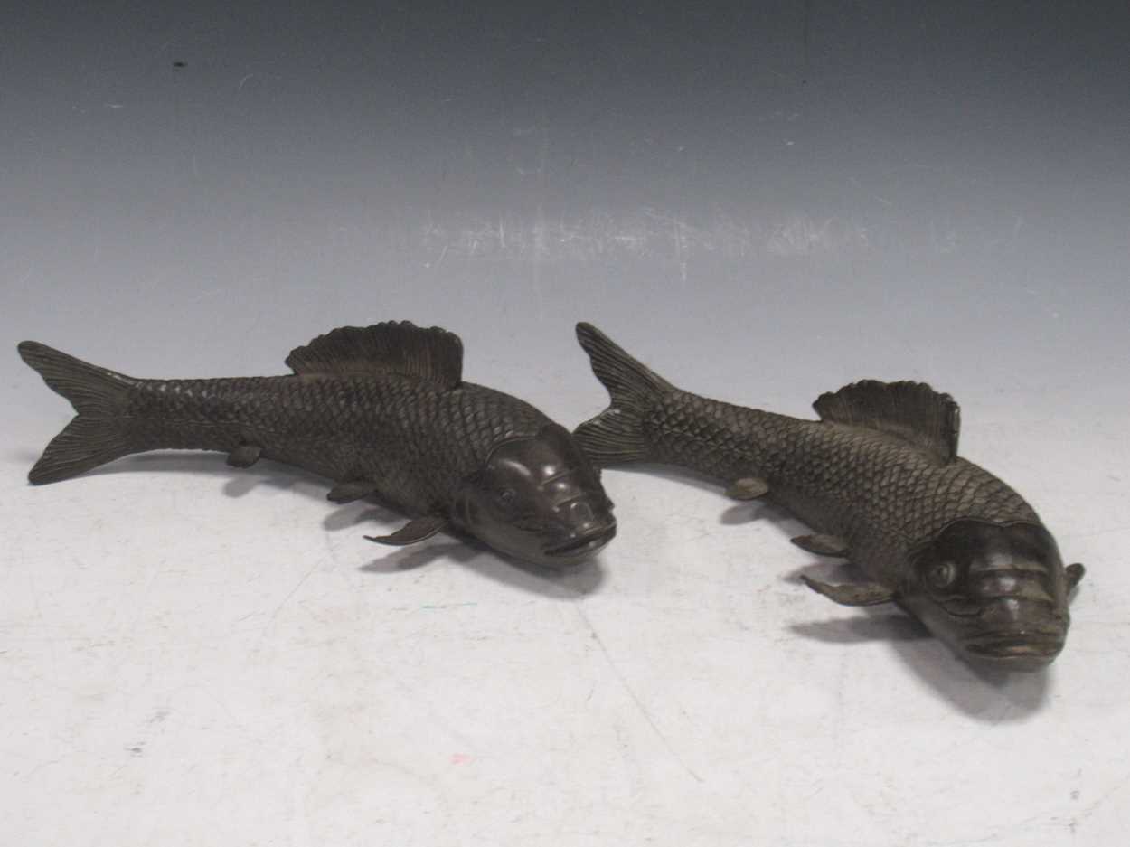 Lot 24 - A pair of models of carp, the metal with...