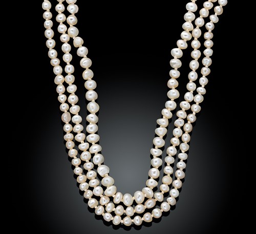 Lot 191 - A triple row natural saltwater pearl necklace
