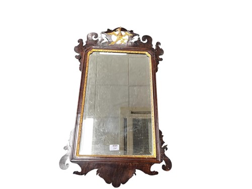 Lot 757 - A mahogany and gilt fret work mirror with hoho...