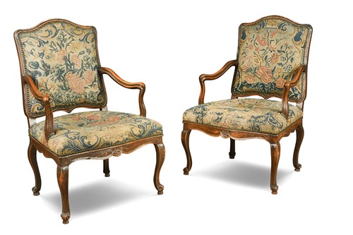 Lot 546 - A pair of Louis XV walnut armchairs