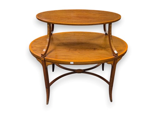 Lot 781 - A mahogany Sheraton style oval two tier table,...