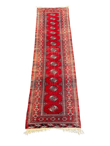 Lot 798 - A Persian red ground runner, 301 x 81cm