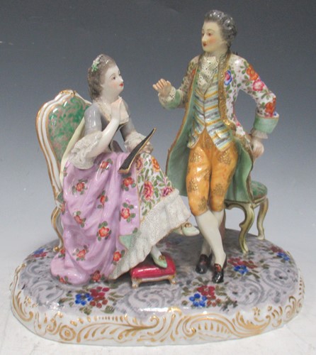 Lot 28 - A German porcelain conversation piece,...