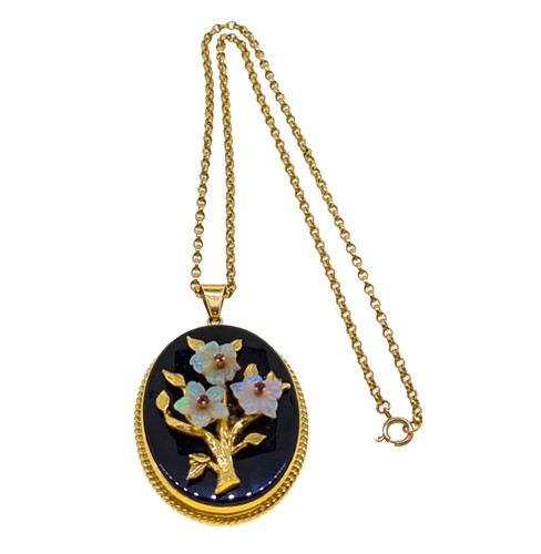 Lot 40 - An onyx, opal and ruby pendant and chain