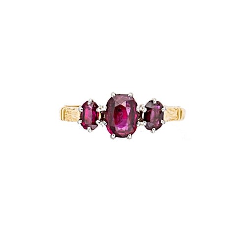Lot 134 - An 18ct gold three stone ruby ring