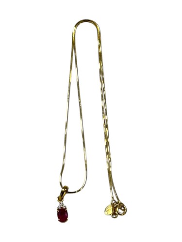 Lot 387 - A synthetic ruby and diamond pendant and chain,...