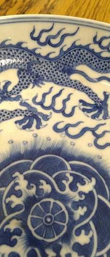 Lot 18 - A Chinese blue and white plate decorated with...