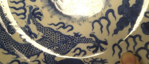 Lot 18 - A Chinese blue and white plate decorated with...