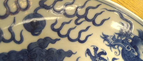 Lot 18 - A Chinese blue and white plate decorated with...