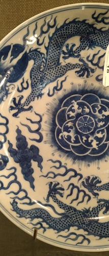 Lot 18 - A Chinese blue and white plate decorated with...