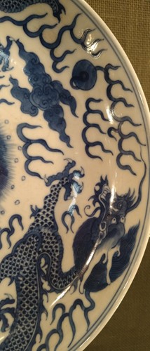 Lot 18 - A Chinese blue and white plate decorated with...
