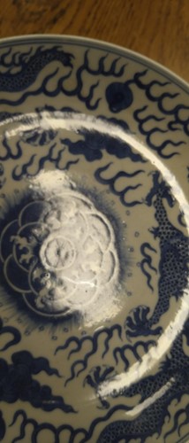 Lot 18 - A Chinese blue and white plate decorated with...