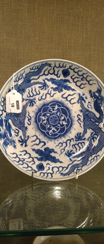 Lot 18 - A Chinese blue and white plate decorated with...