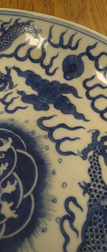 Lot 18 - A Chinese blue and white plate decorated with...