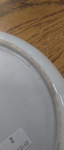 Lot 18 - A Chinese blue and white plate decorated with...