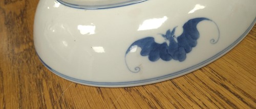 Lot 18 - A Chinese blue and white plate decorated with...