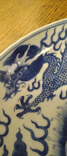 Lot 18 - A Chinese blue and white plate decorated with...