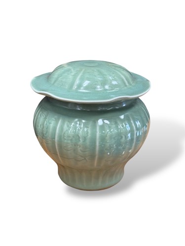 Lot 185 - A Chinese celadon vase and cover of baluster...