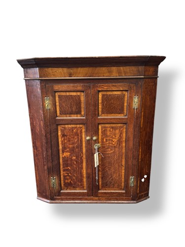 Lot 684 - A George III oak and mahogany banded hanging...