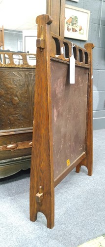 Lot 175 - Liberty & Co., an Arts & Crafts tooled leather and oak fire screen