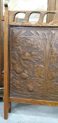 Lot 175 - Liberty & Co., an Arts & Crafts tooled leather and oak fire screen