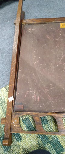 Lot 175 - Liberty & Co., an Arts & Crafts tooled leather and oak fire screen