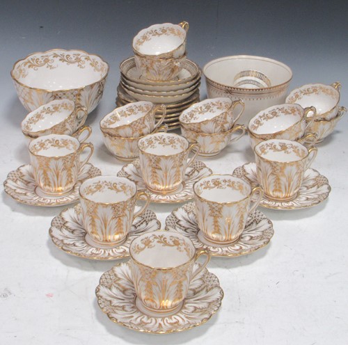 Lot 147 - A 19th century white and gilt tea service,...