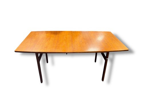 Lot 760 - A mid-20th century teak extending dining table...