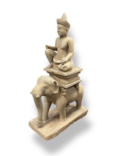 Lot 212 - An Indian carved stone figure seated upon an...