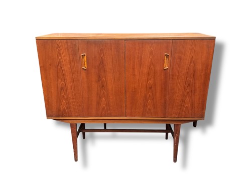 Lot 761 - A teak side cabinet, mid 20th century, with...