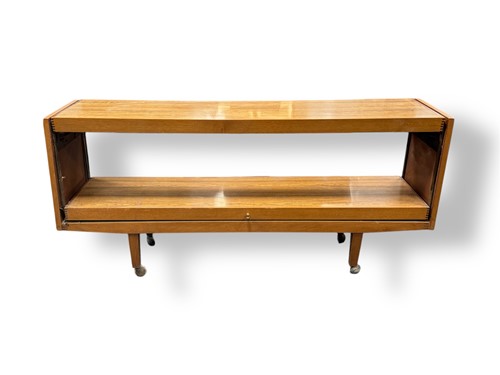 Lot 762 - A teak veneered two tier sideboard, modern,...