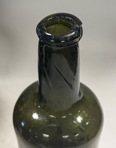 Lot 402 - Three green glass wine bottles, 18th century