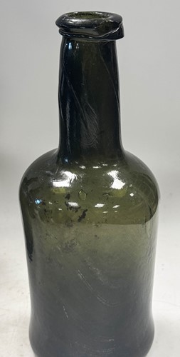 Lot 402 - Three green glass wine bottles, 18th century
