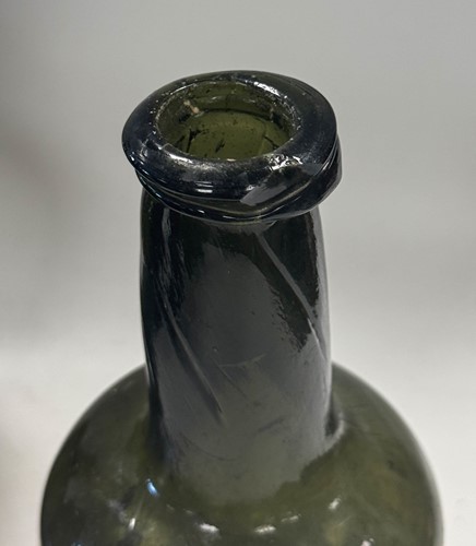 Lot 402 - Three green glass wine bottles, 18th century