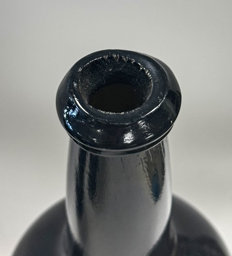 Lot 402 - Three green glass wine bottles, 18th century