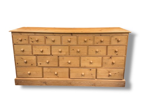 Lot 704 - A modern pine chest of twenty two drawers, 85...