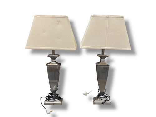 Lot 791 - A pair of Parex metal vase shaped table...