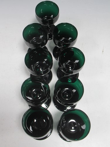 Lot 12 - A set of nine green glass wine glasses with...