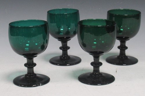 Lot 36 - Four mid-18th century small dark green wine...
